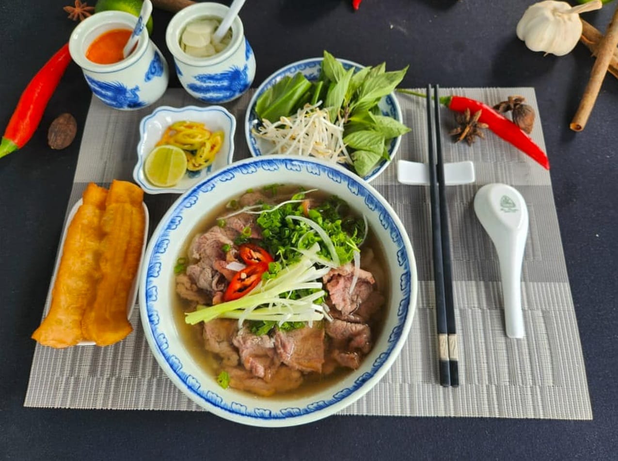 The bowl of pho features a harmonious blend of the delicious broth, the chewy texture of the rice noodles, and the fragrant herbs.