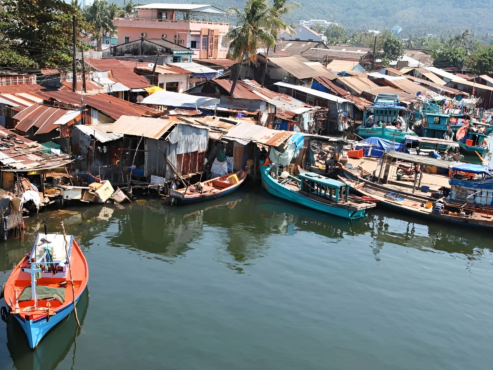 The traditional pier and boats at Ham Ninh Fishing Village offering fresh seafood near Corona Casino Phu Quoc