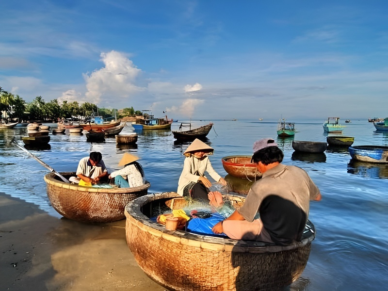 Visitors observing Rach Vem fishermen mending nets a unique cultural insight into the local maritime community near Corona Casino Phu Quoc