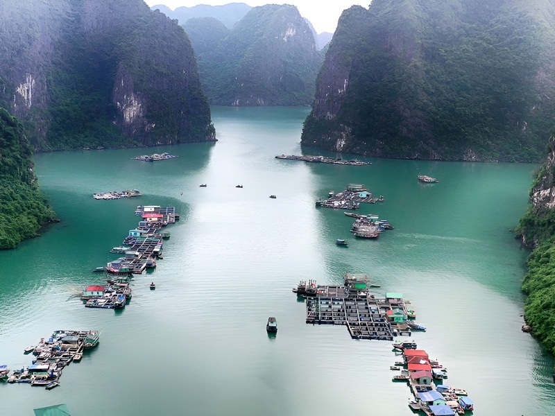 Traditional Cua Can river boats and stilt houses reflecting local life near the resort area of Corona Casino Phu Quoc