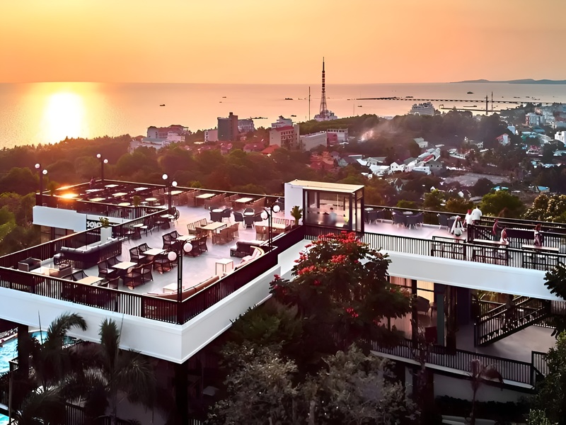 Guests enjoying coffee and the Panoramic view from Hon Tra Hill Cafe showing Phu Quoc's landscape away from Corona Casino Phu Quoc