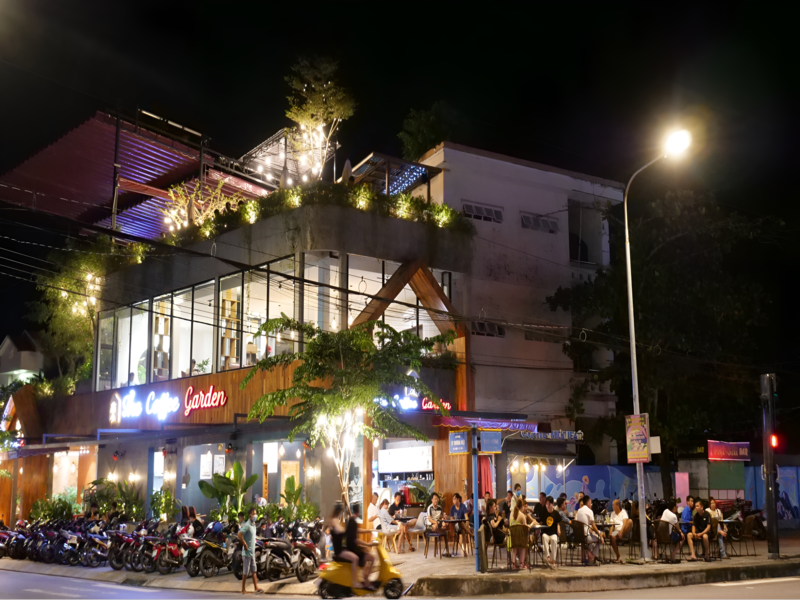 Guests enjoying the beautiful natural setting of The Coffee Garden Phu Quoc a peaceful retreat close to Corona Casino Phu Quoc