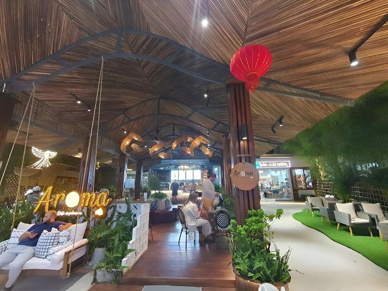 The inviting interior of Aroma Cafe Phu Quoc featuring cozy decor a pleasant stop near Corona Casino Phu Quoc