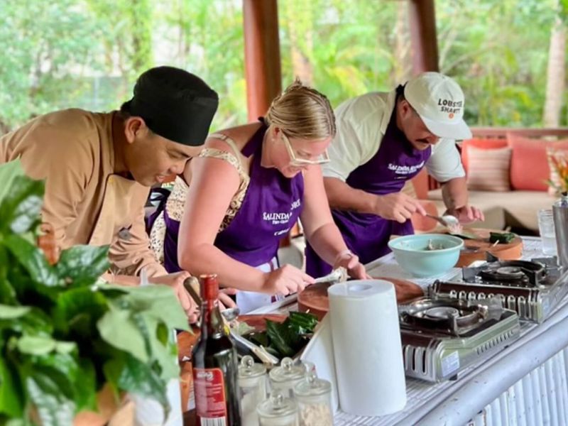 Travelers enjoying the Salinda Resort Vietnamese Cooking Class as part of a luxury island tour including Corona Casino Phu Quoc