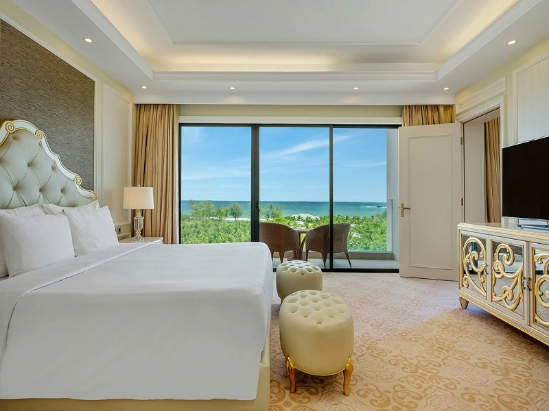 Opulent resort bedroom suite overlooking the ocean at Corona Resort & Casino Phu Quoc