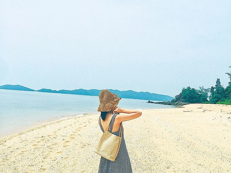 A solo traveler exploring a quiet secluded bay in Phu Quoc