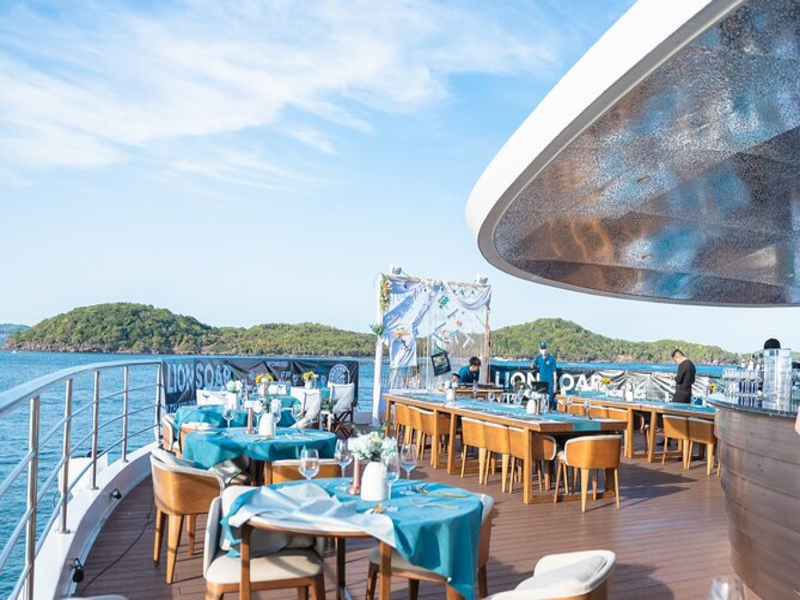 Phu Quoc dinner cruise boat sailing toward sunset near Corona Resort & Casino Phu Quoc