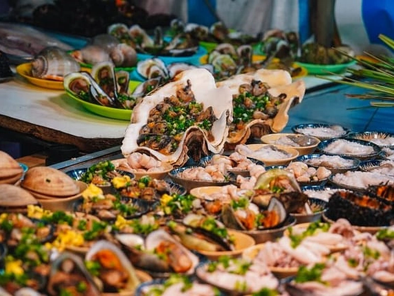 Vibrant seafood stall with scallops and snails on a Phu Quoc food tour near Corona Resort & Casino Phu Quoc