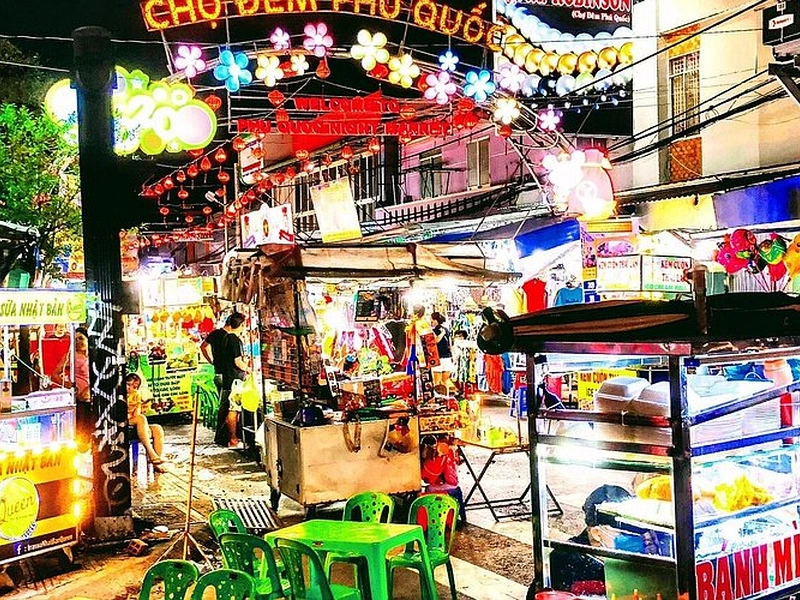 Brightly lit entrance archway of the famous Phu Quoc Night Market during a food tour close to Corona Resort & Casino Phu Quoc