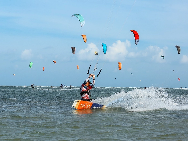 A kitesurfer riding waves on the ocean close to Corona Resort & Casino Phu Quoc