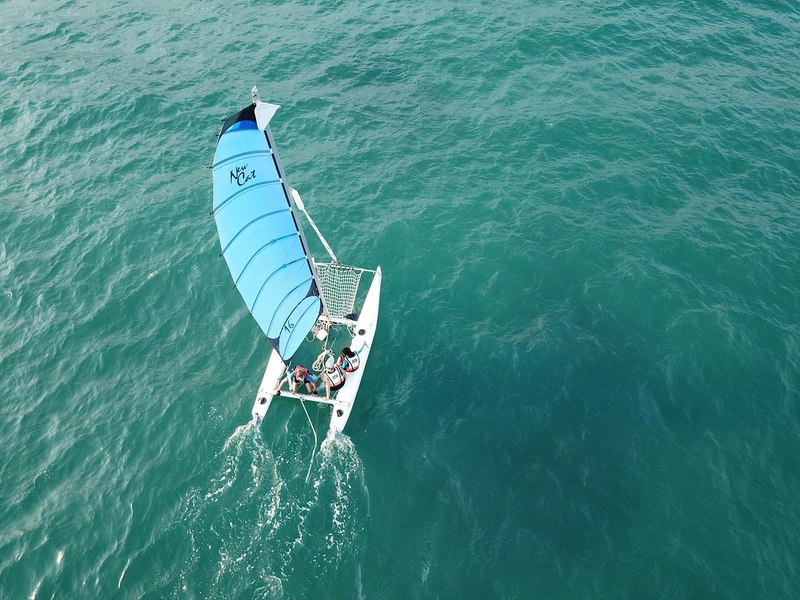 Sailboat sailing in Phu Quoc on calm waters near Corona Resort & Casino Phu Quoc